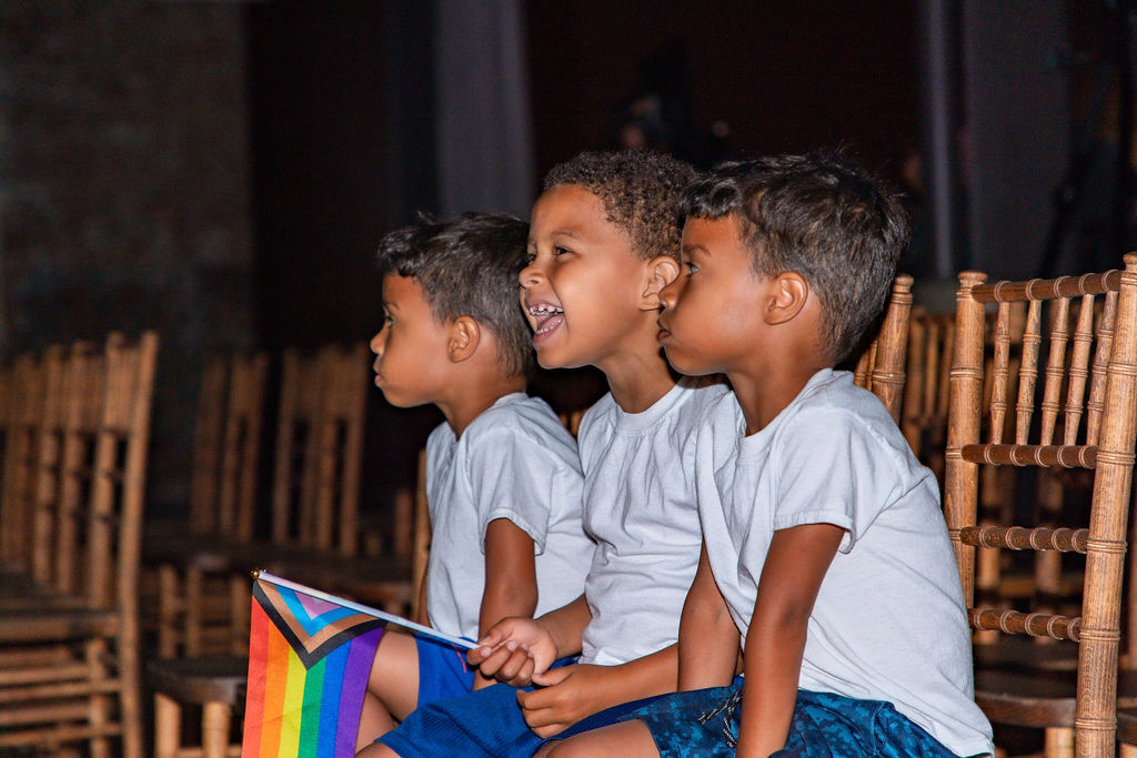 Angel Fonseca's sons watching Stories for Freedom performance